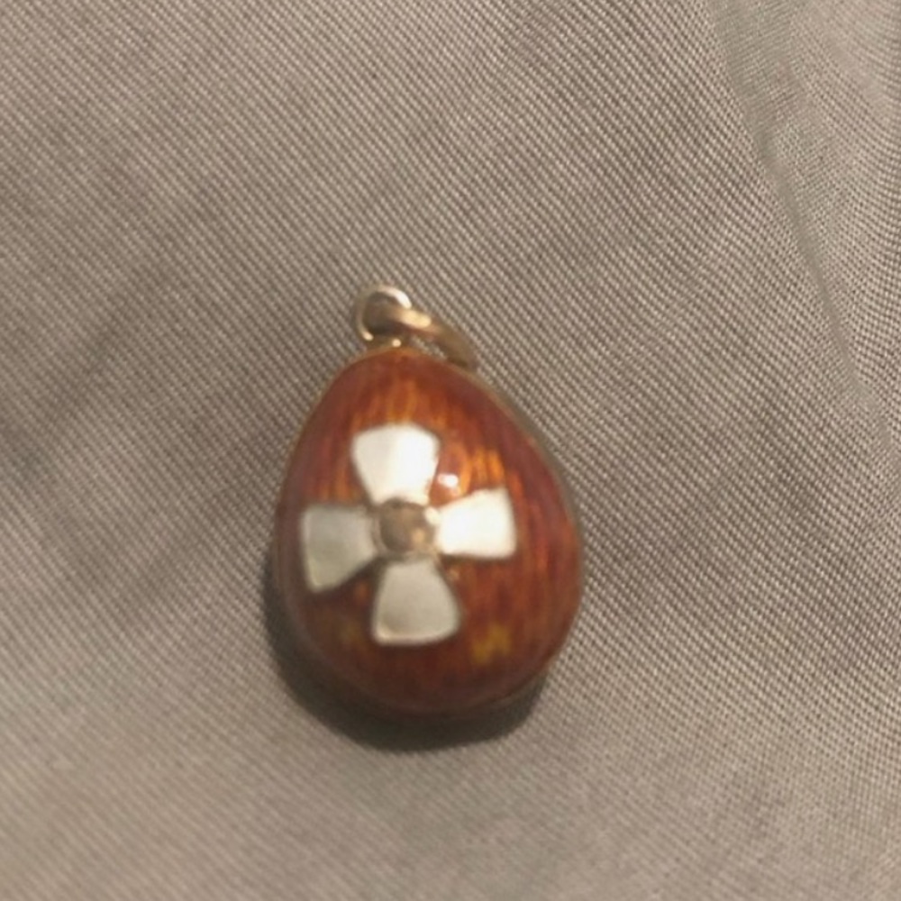 Antique egg pendent in orange colour with cross in guilloche enamel